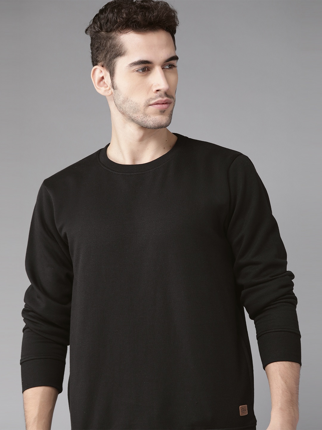 

Roadster Men Black Solid Sweatshirt