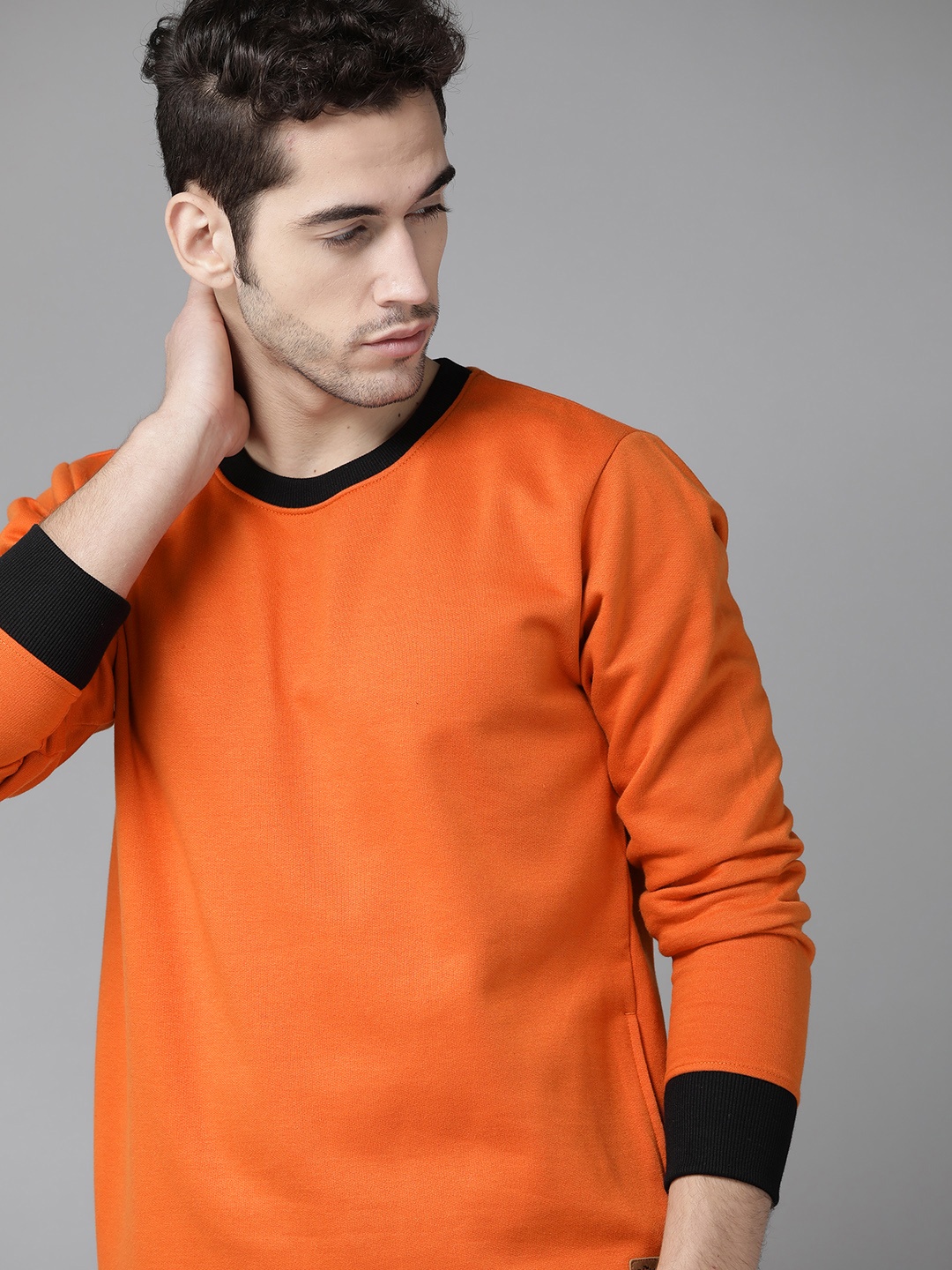 

Roadster Men Orange Solid Sweatshirt