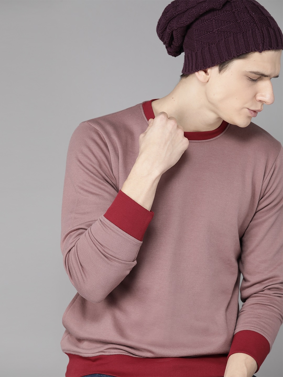 

Roadster Men Dusty Pink Solid Sweatshirt