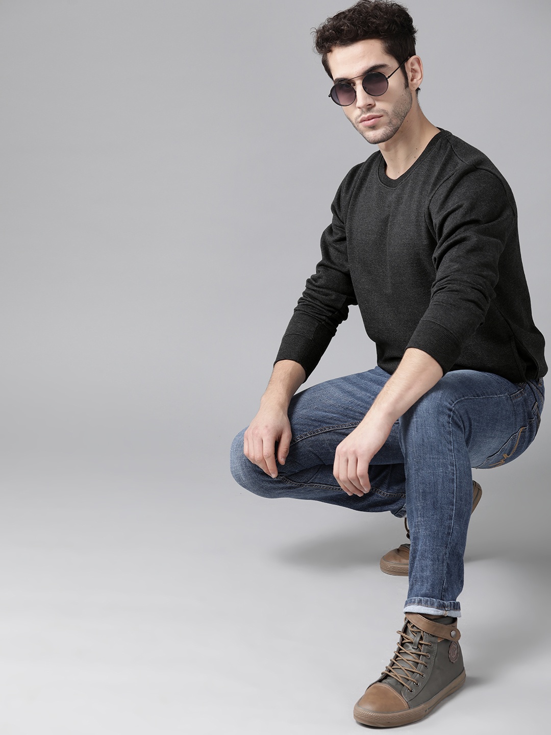 

Roadster Men Charcoal Grey Solid Sweatshirt
