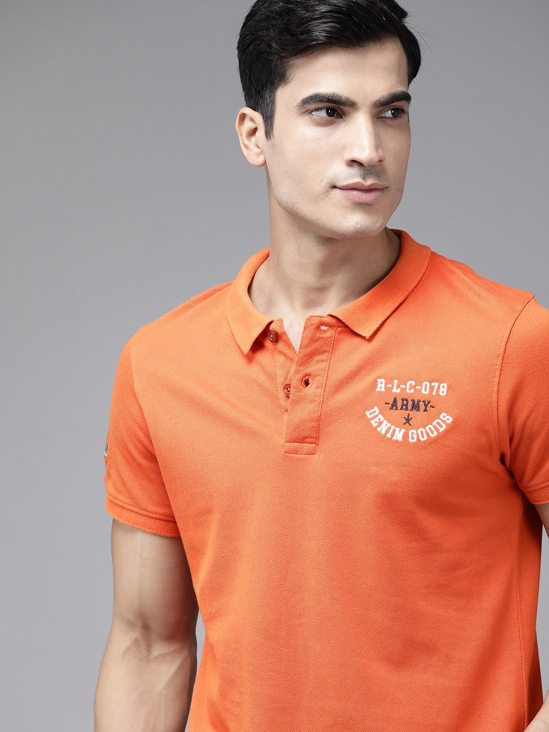 

Roadster Men Coral Orange Solid Pure Cotton Polo Collar T-shirt