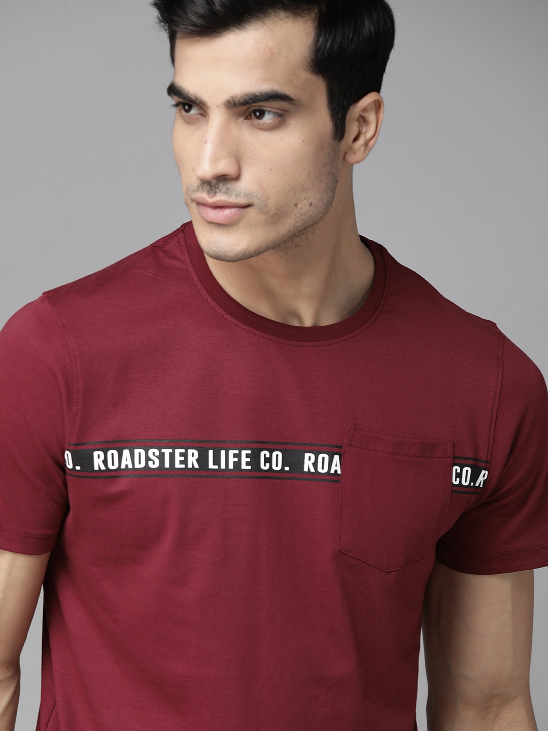 

Roadster Men Burgundy Solid Round Neck T-shirt with Printed Detail