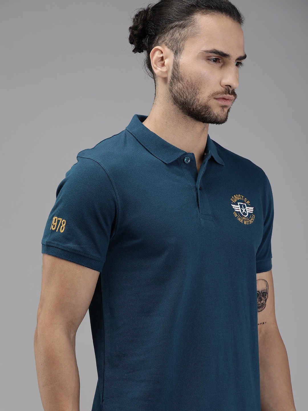 

Roadster Men Teal Blue Solid Polo Collar Pure Cotton T-shirt with Embroidery