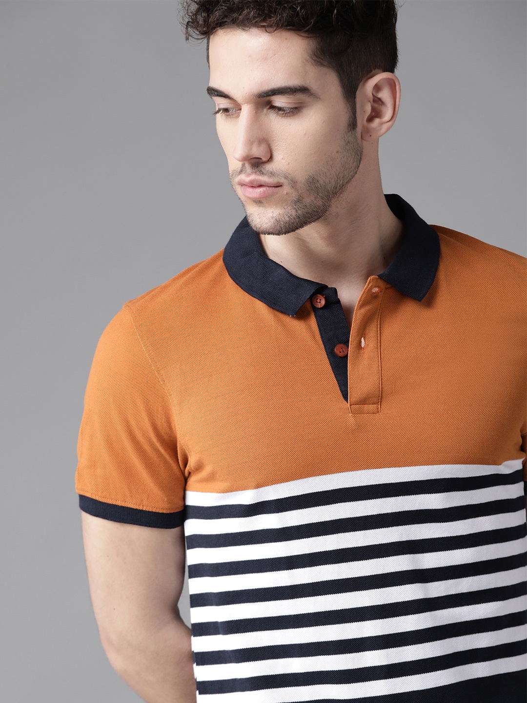 

Roadster Men Rust Orange & Navy Blue Striped Polo Collar T-shirt