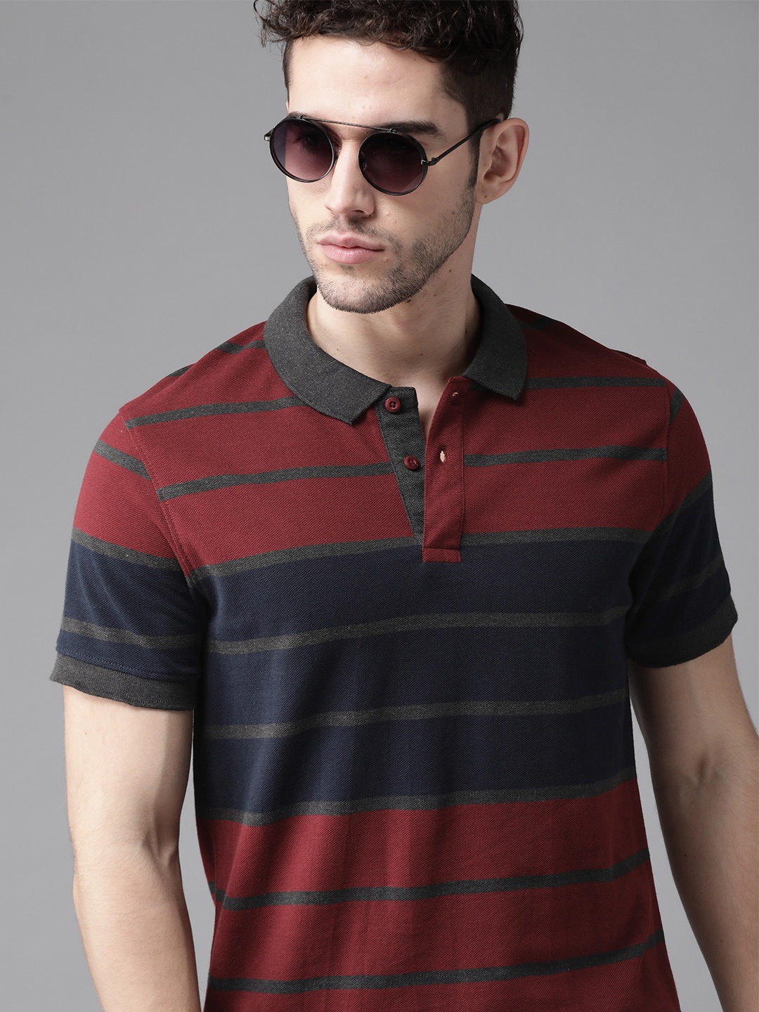 

Roadster Men Maroon & Navy Blue Striped Polo Collar T-shirt
