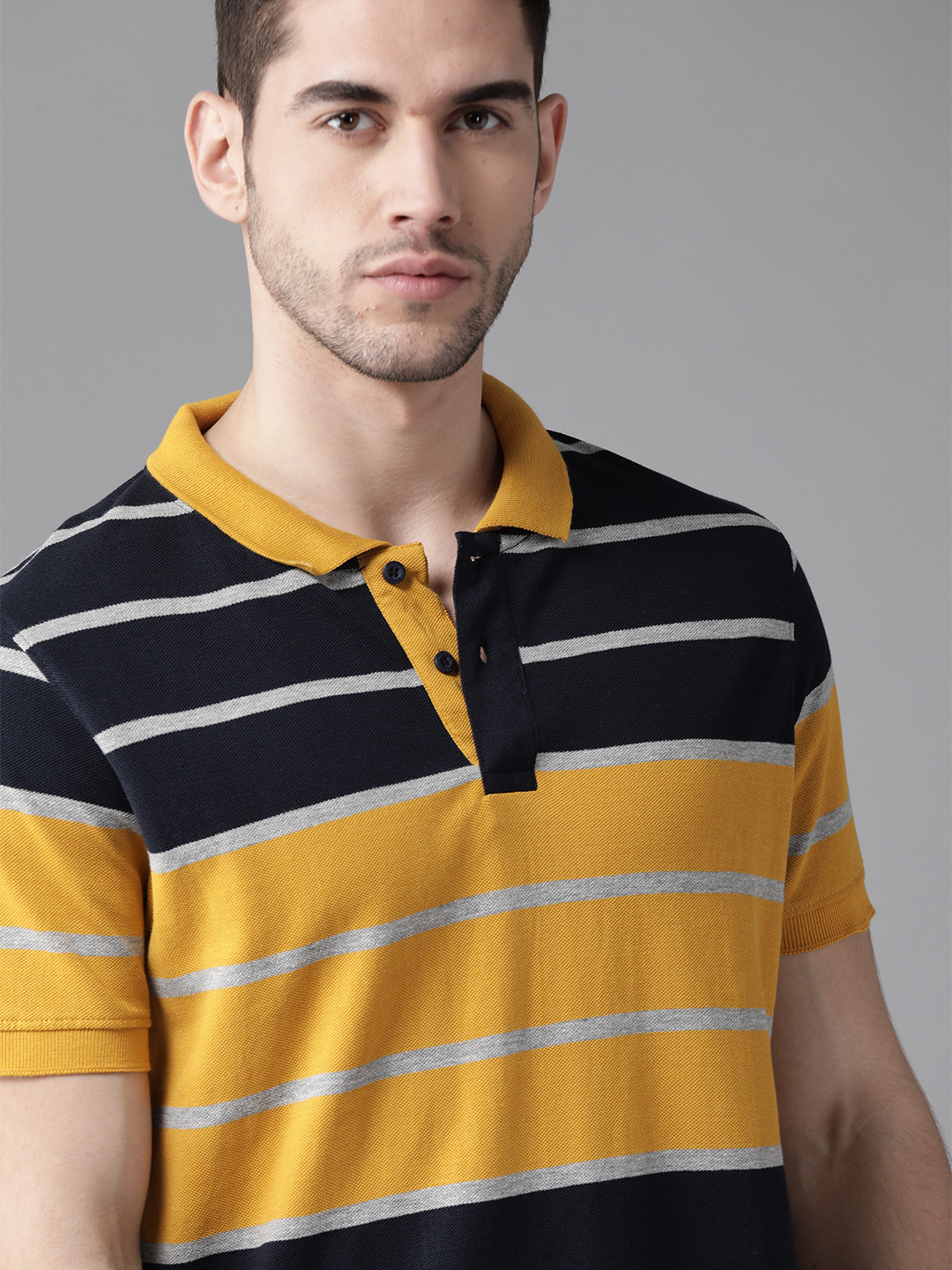

Roadster Men Mustard Yellow & Navy Blue Striped Polo Collar T-shirt