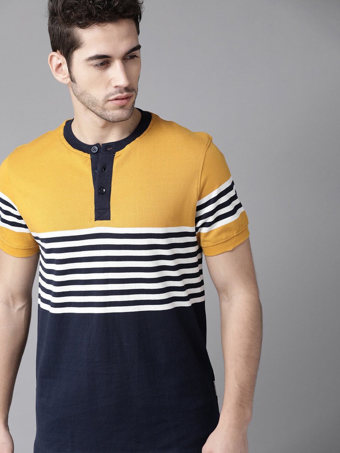 

Roadster Men Yellow & Navy Blue Striped Henley Neck T-shirt