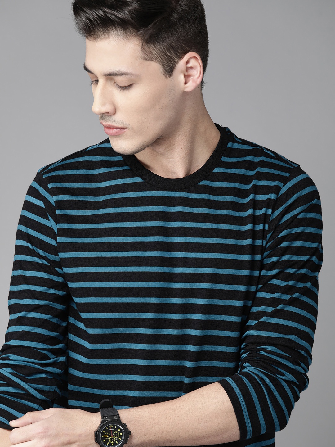 

Roadster Men Black & Blue Striped Round Neck T-shirt