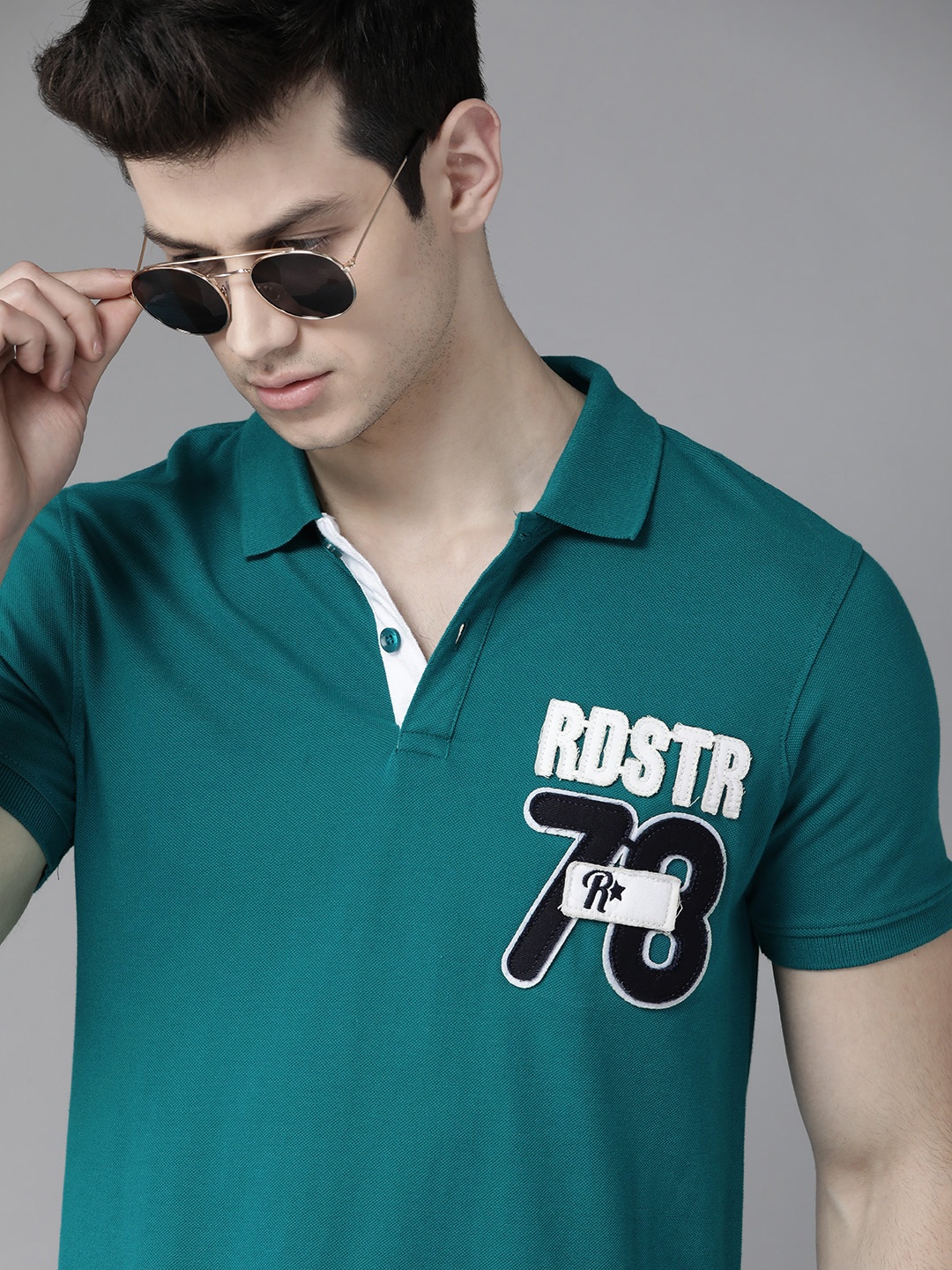 

Roadster Men Teal Green Solid Polo Collar Pure Cotton T-shirt with Applique Detail