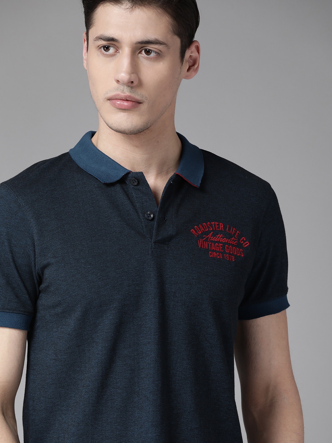 

Roadster Men Teal Blue Solid Polo Collar T-shirt with Embroidered Detail