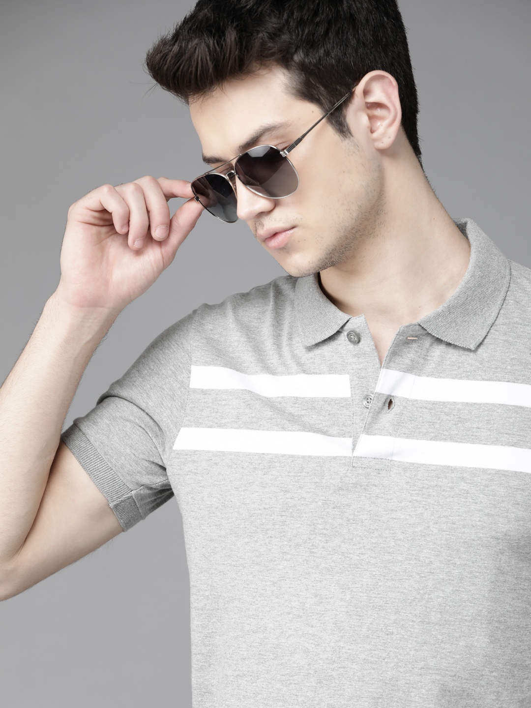 

Roadster Men Grey Melange & White Striped Polo Collar T-shirt