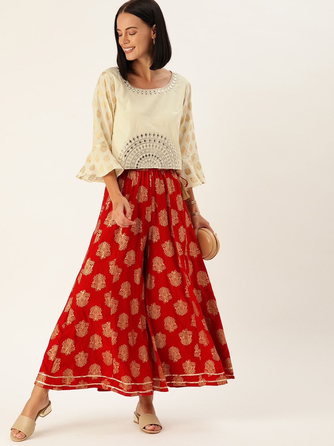 

Varanga Women Off-White & Gold-Toned Embellished Mirror Work Top with Palazzos