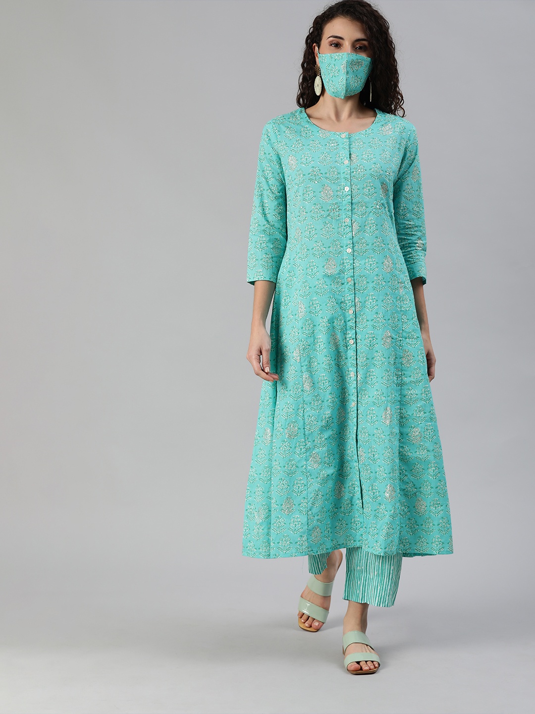 

Ishin Women Turquoise Blue White Printed Sequinned A-line Kurta Set