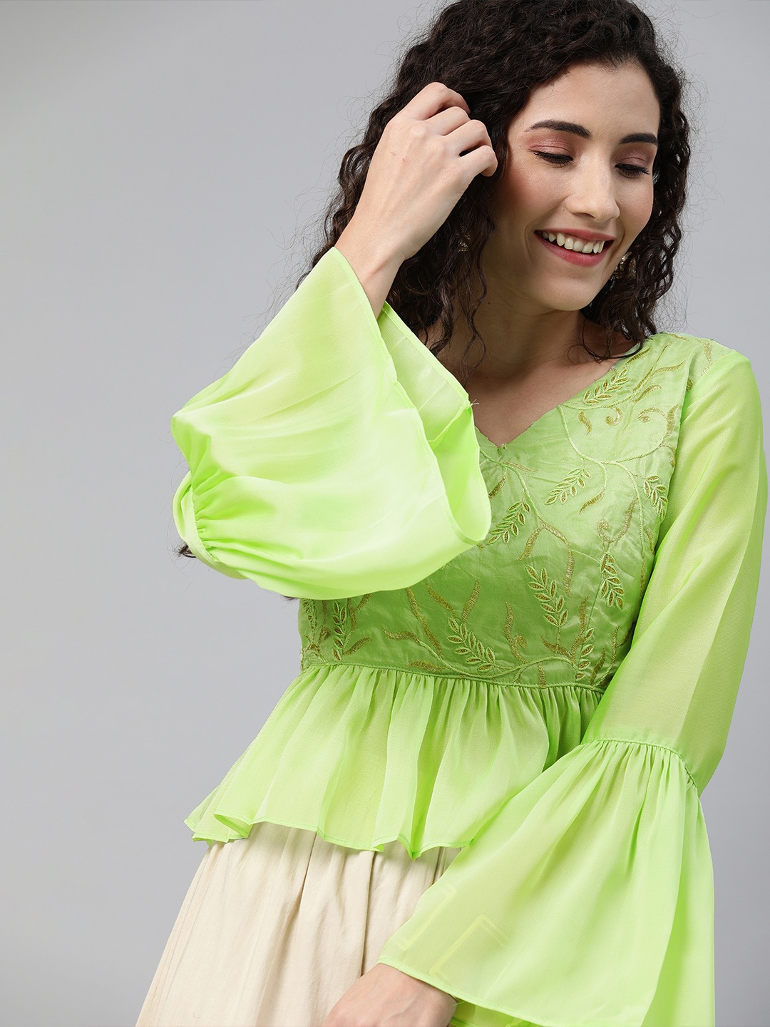 

Inddus Women Green Embroidered Peplum Ethnic Top with Bell Sleeves