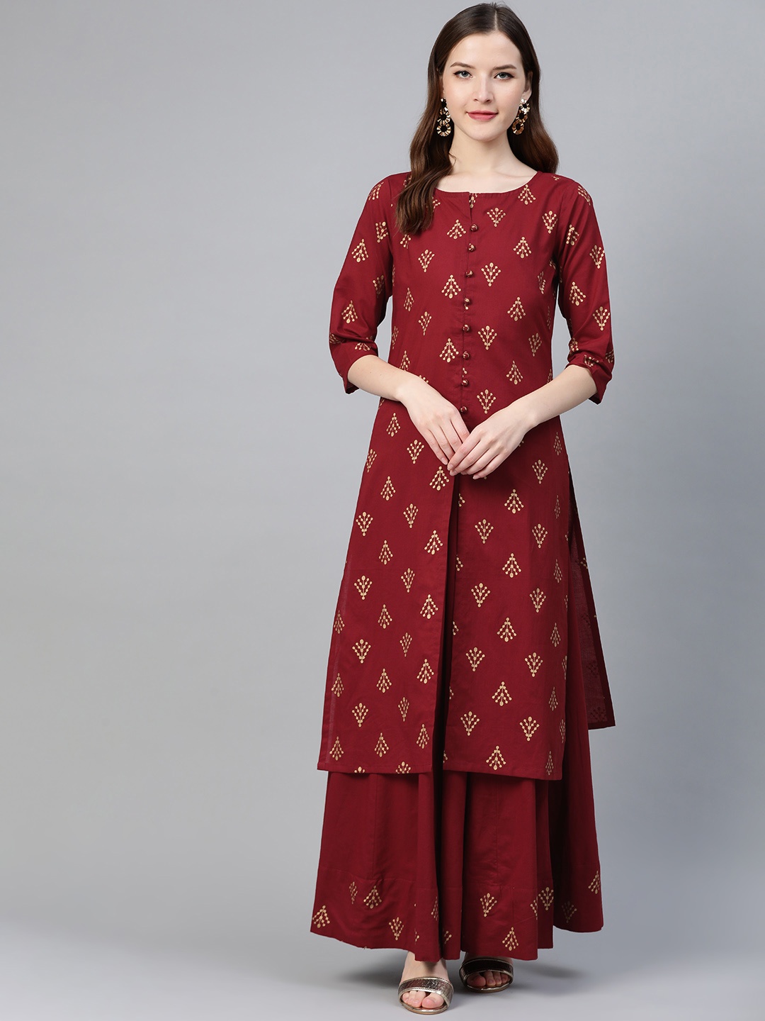 

Idalia Women Maroon & Golden Printed Kurta with Skirt