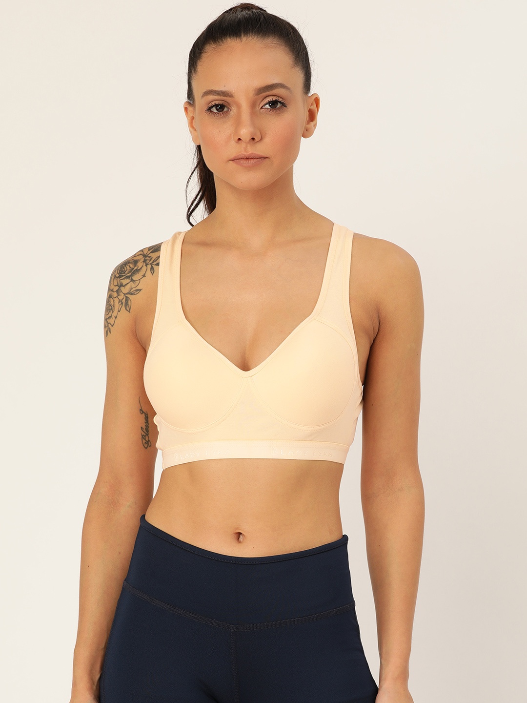 

Lady Lyka Cream-Coloured Solid Non-Wired Lightly Padded Racerback Sports Bra PROVOGUE
