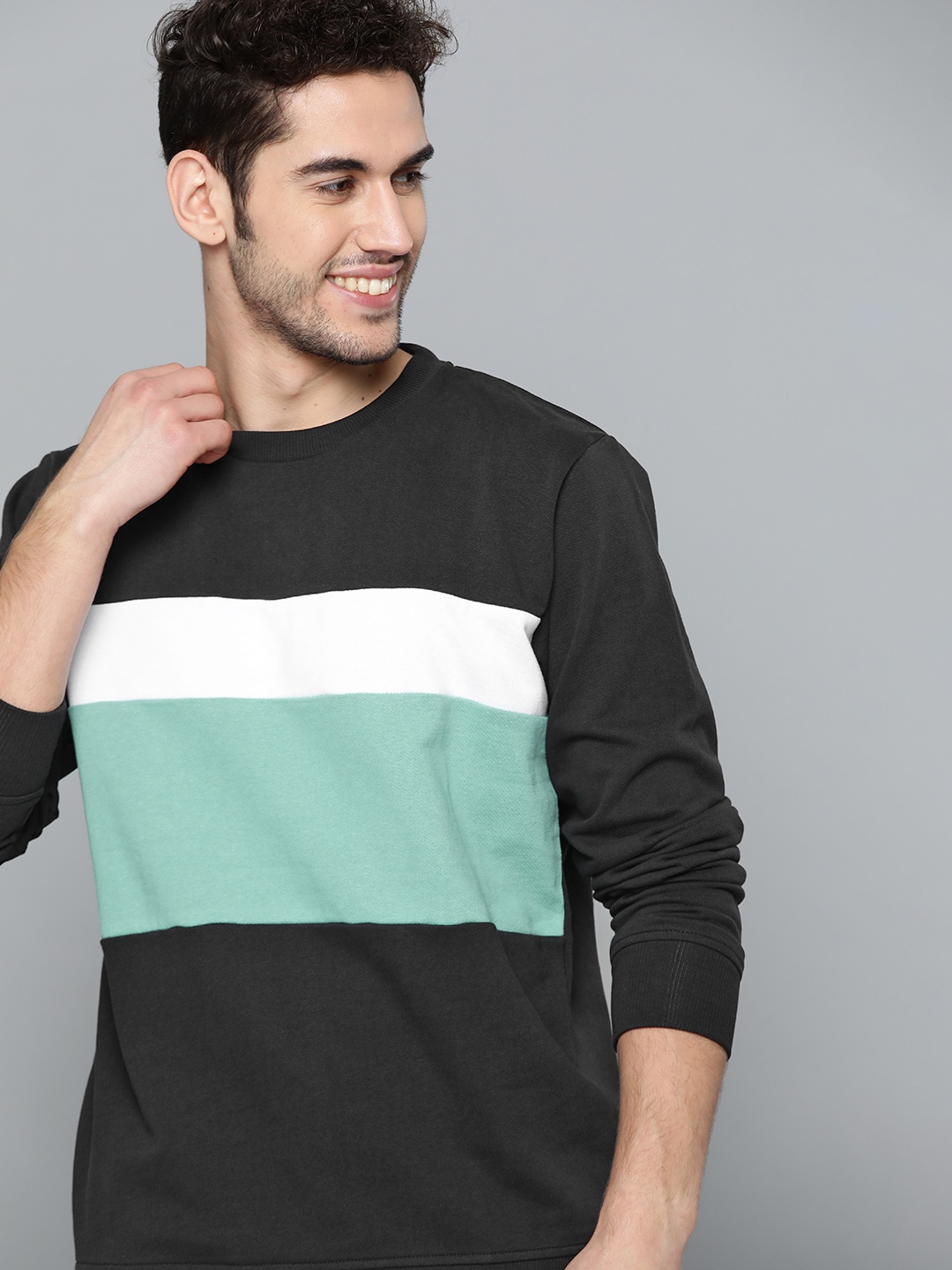 

Mast & Harbour Men Black & Sea Green Colourblocked Sweatshirt