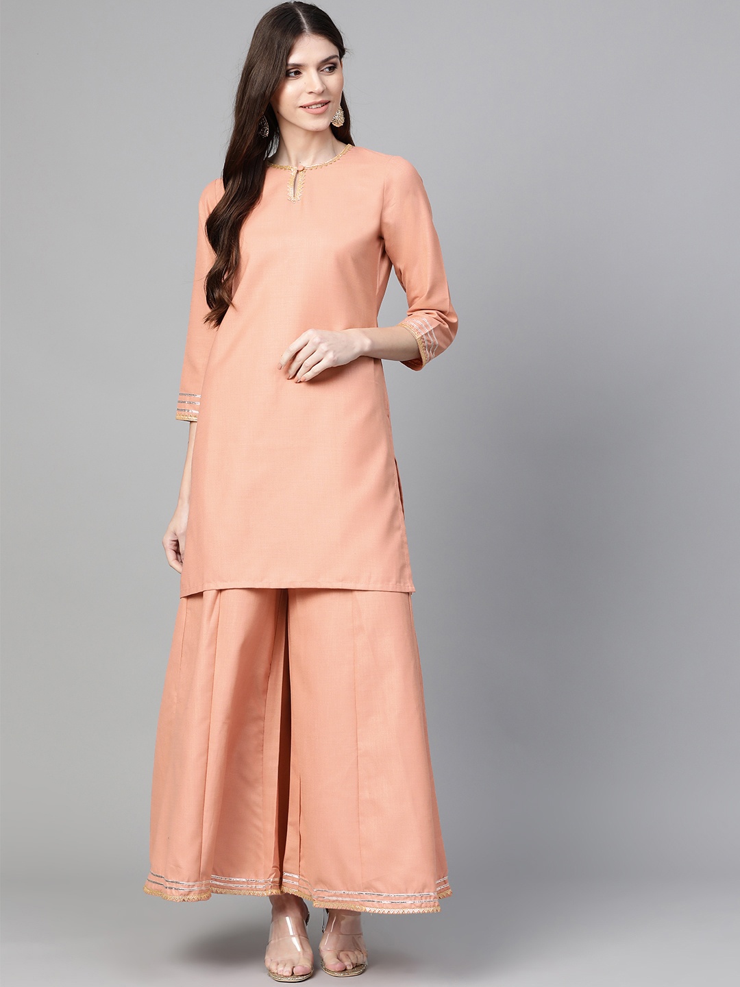 

Bhama Couture Women Peach-Coloured Solid Kurta with Palazzos