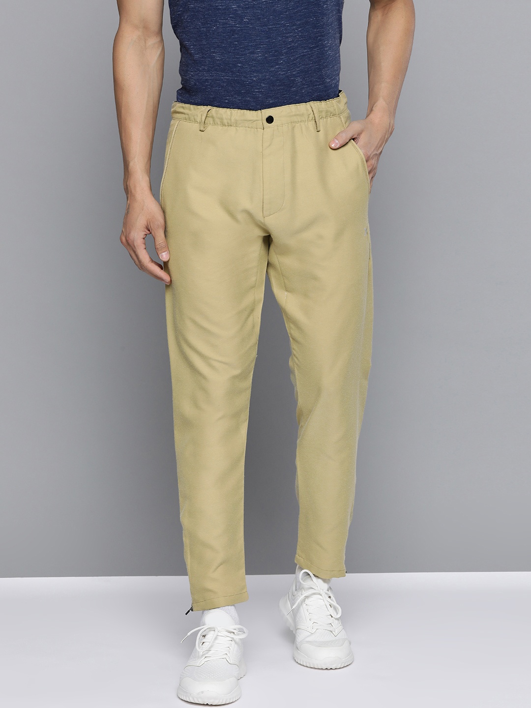 

HRX by Hrithik Roshan Men Sponge Solid Tapered Fit Rapid-Dry Lifestyle Trousers, Beige