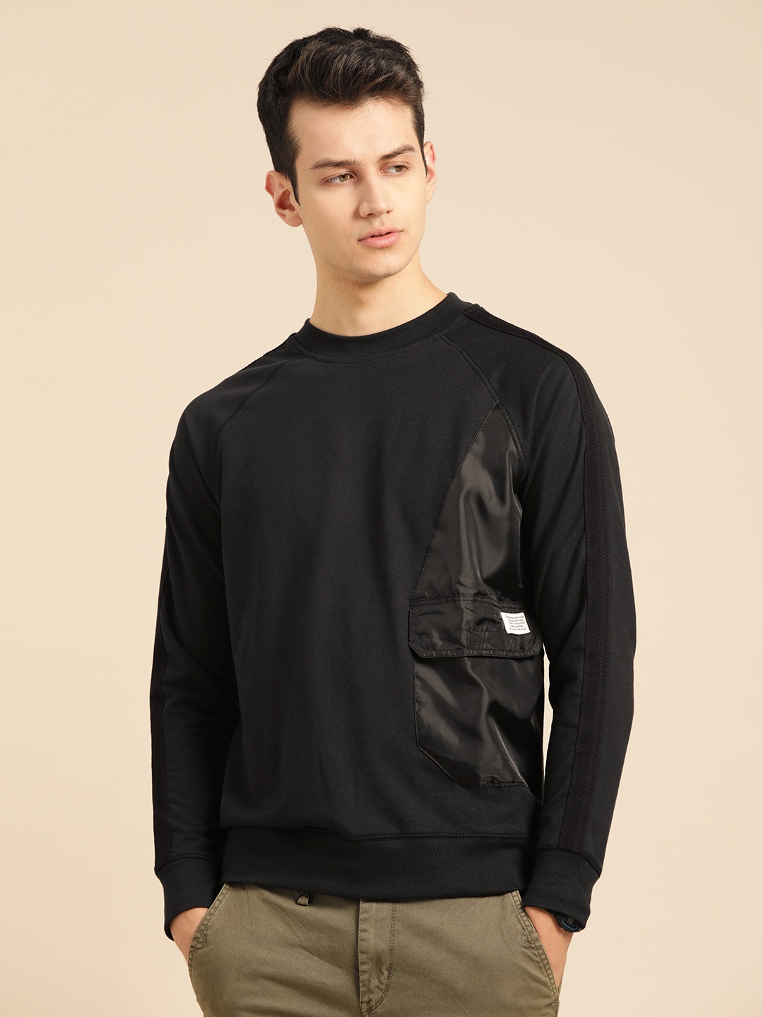 

Mr Bowerbird Men Black Solid Sweatshirt