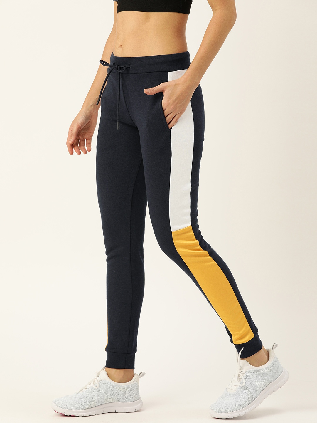 

Campus Sutra Women Black Solid Sports Dry-Fit Tights with Side Stripe, Blue