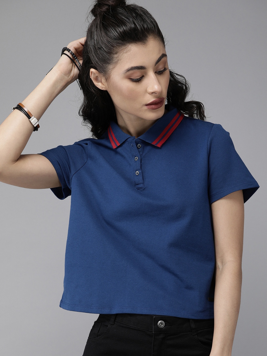 

Roadster Women Blue Solid Polo Collar T-shirt