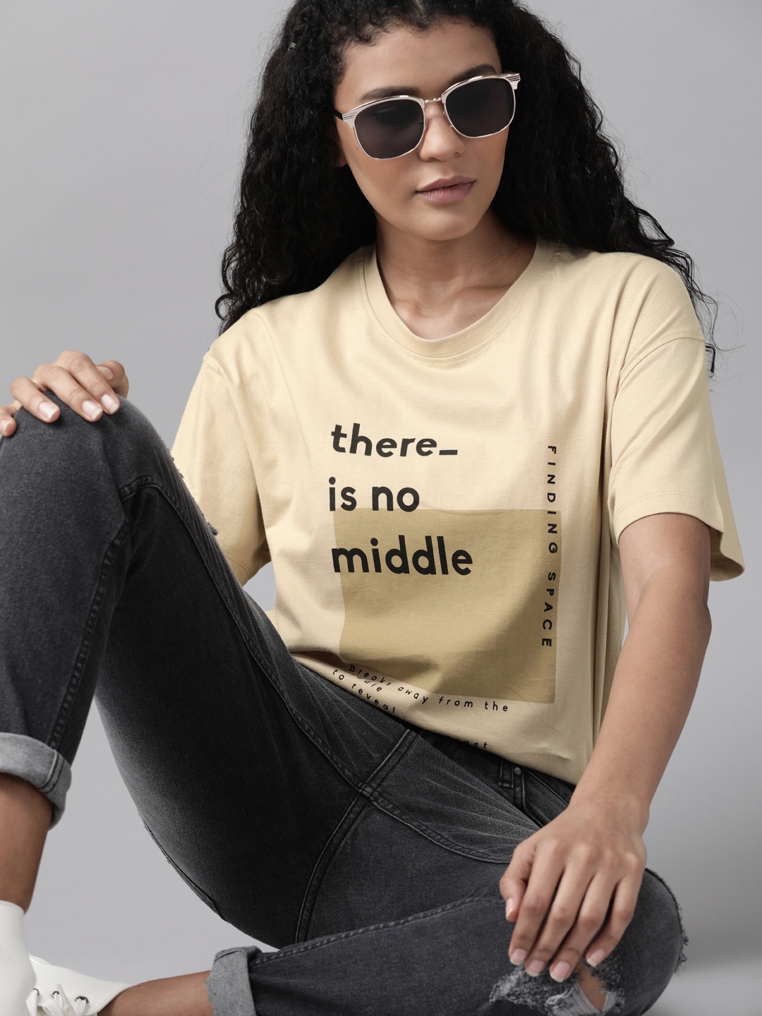 

Roadster Women Beige & Black Printed Round Neck T-shirt