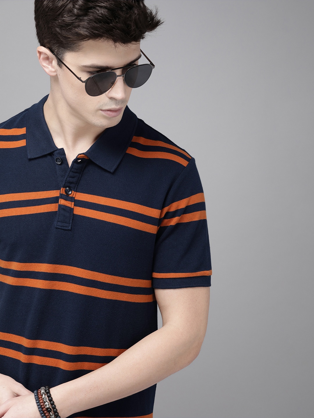 

Roadster Men Navy Blue Orange Striped Polo Collar Pure Cotton T-shirt