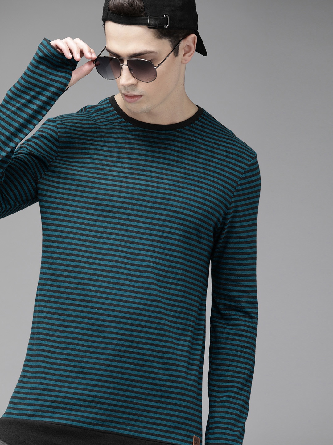 

Roadster Men Teal Blue Black Striped Round Neck Pure Cotton T-shirt with Thumb Hole