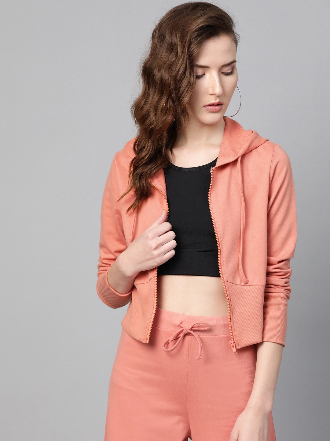 

SASSAFRAS Women Peach-Coloured Solid Hooded Sweatshirt