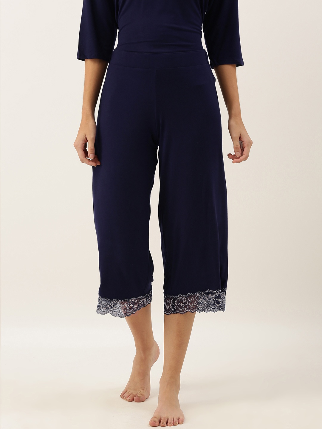 

Amante Women Blue Solid Cropped Lounge Pants with Lace Inserts