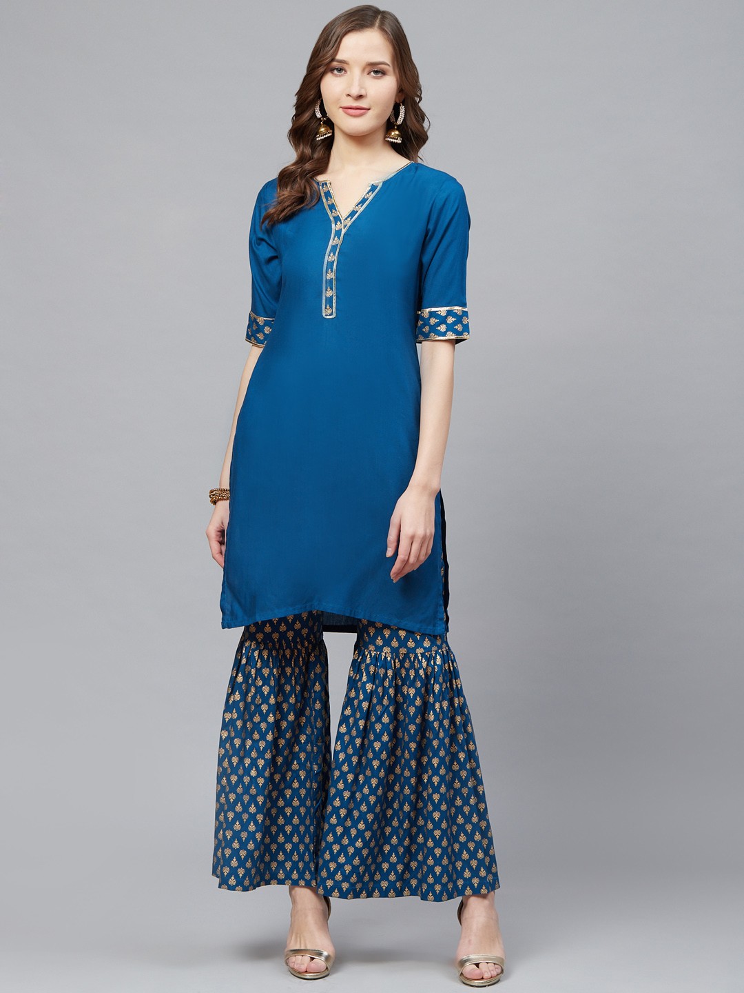 

YASH GALLERY Women Blue & Golden Solid Kurta with Foil Print Sharara