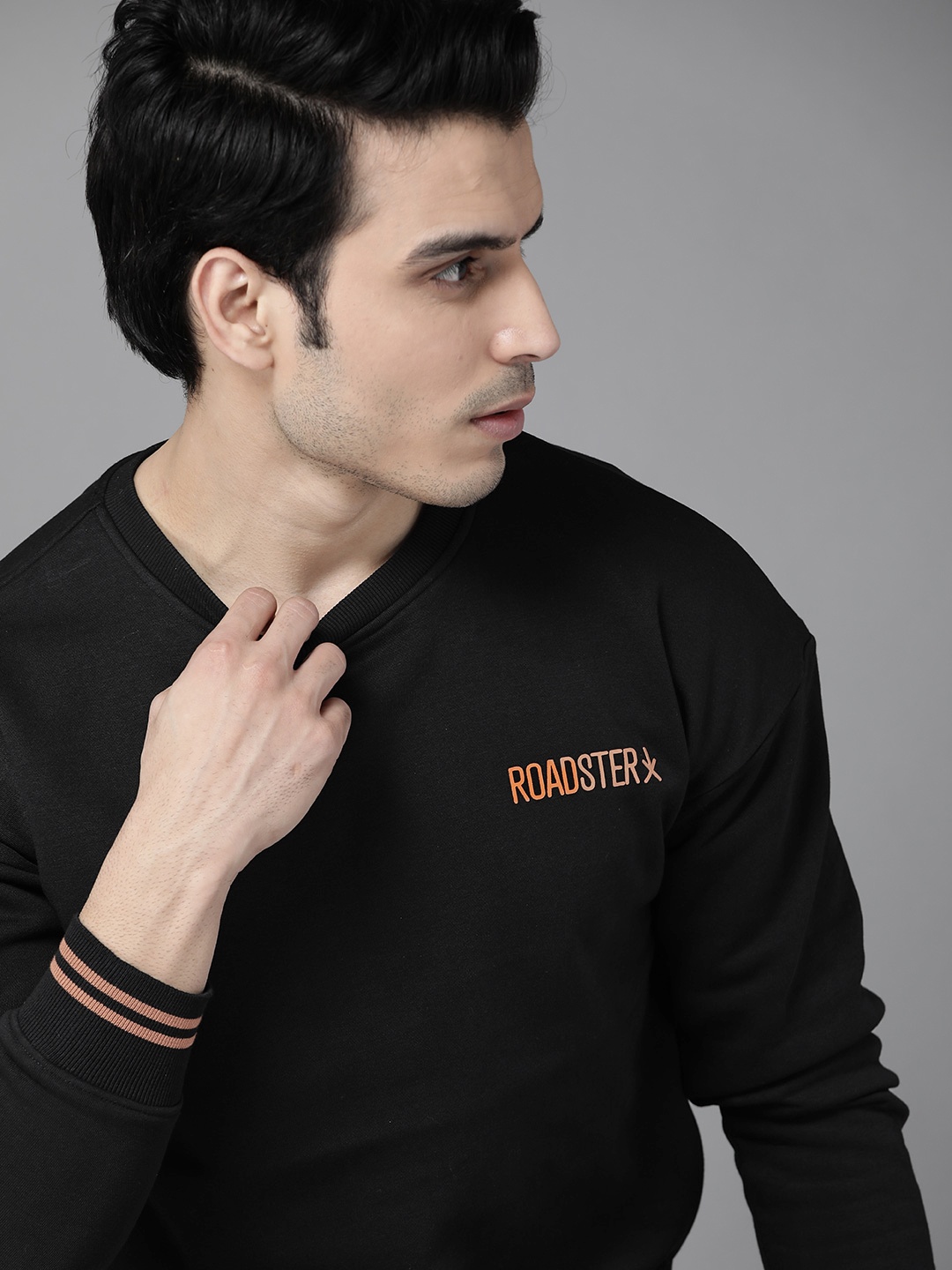 

Roadster Men Black Solid Sweatshirt