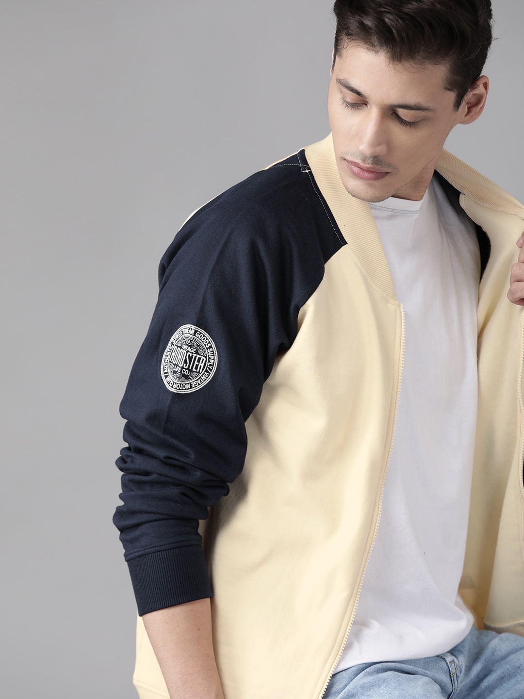 

Roadster Men Cream-Coloured & Navy Blue Solid Sweatshirt