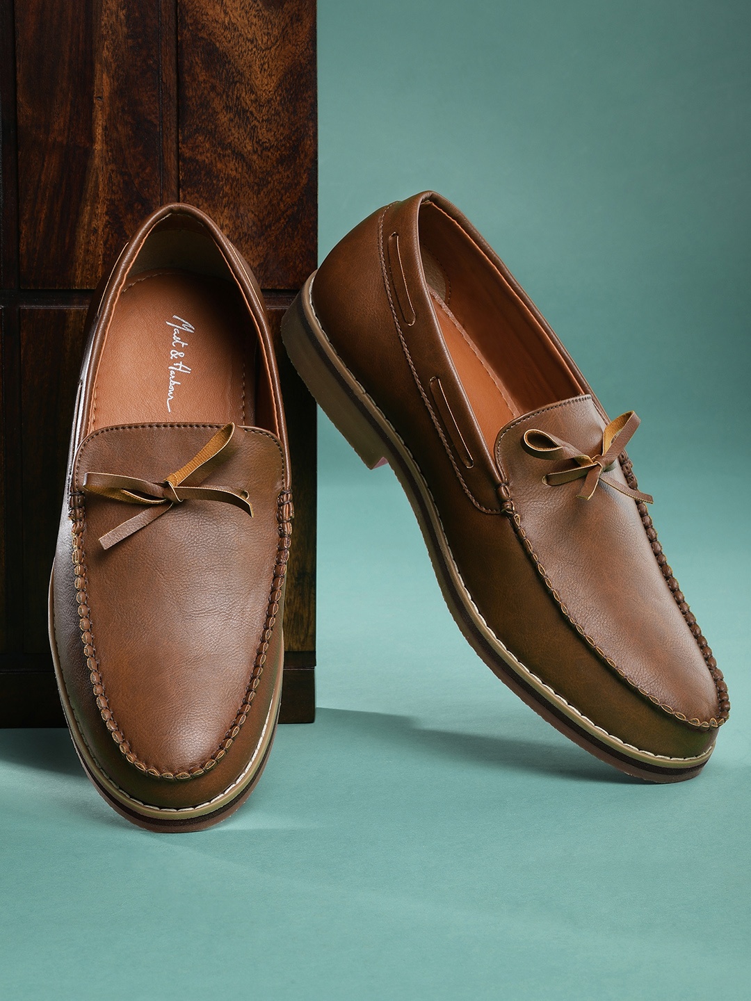 

Mast & Harbour Men Brown Solid Boat Shoes with Tie-Up Detail