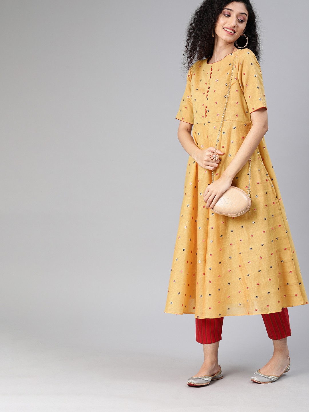 

Inddus Women Mustard Yellow & Red Woven Design A-Line Kurta