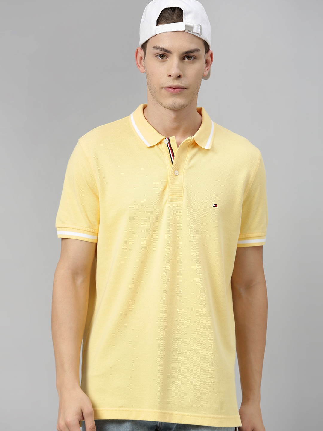 

Tommy Hilfiger Men Yellow Solid Polo Collar Pure Cotton T-shirt