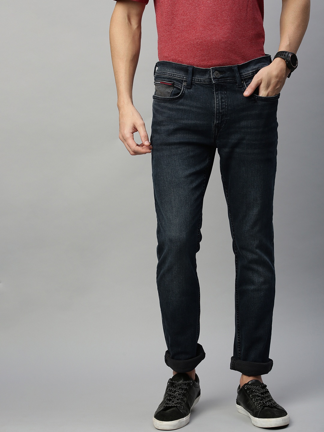 

Tommy Hilfiger Men Blue Slim Fit Mid-Rise Clean Look Stretchable Jeans