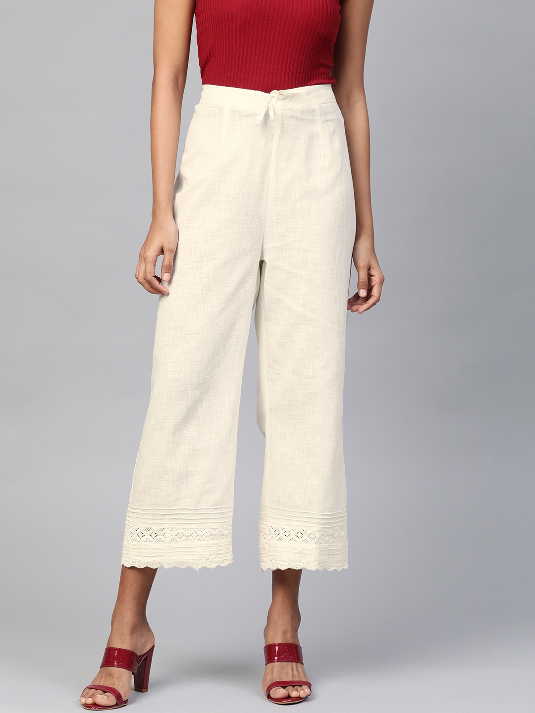 

Laado - Pamper Yourself Women Off-White Solid Straight Palazzos