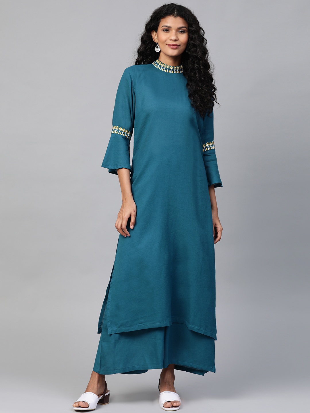 

Laado - Pamper Yourself Women Teal Blue Solid Kurta with Palazzos