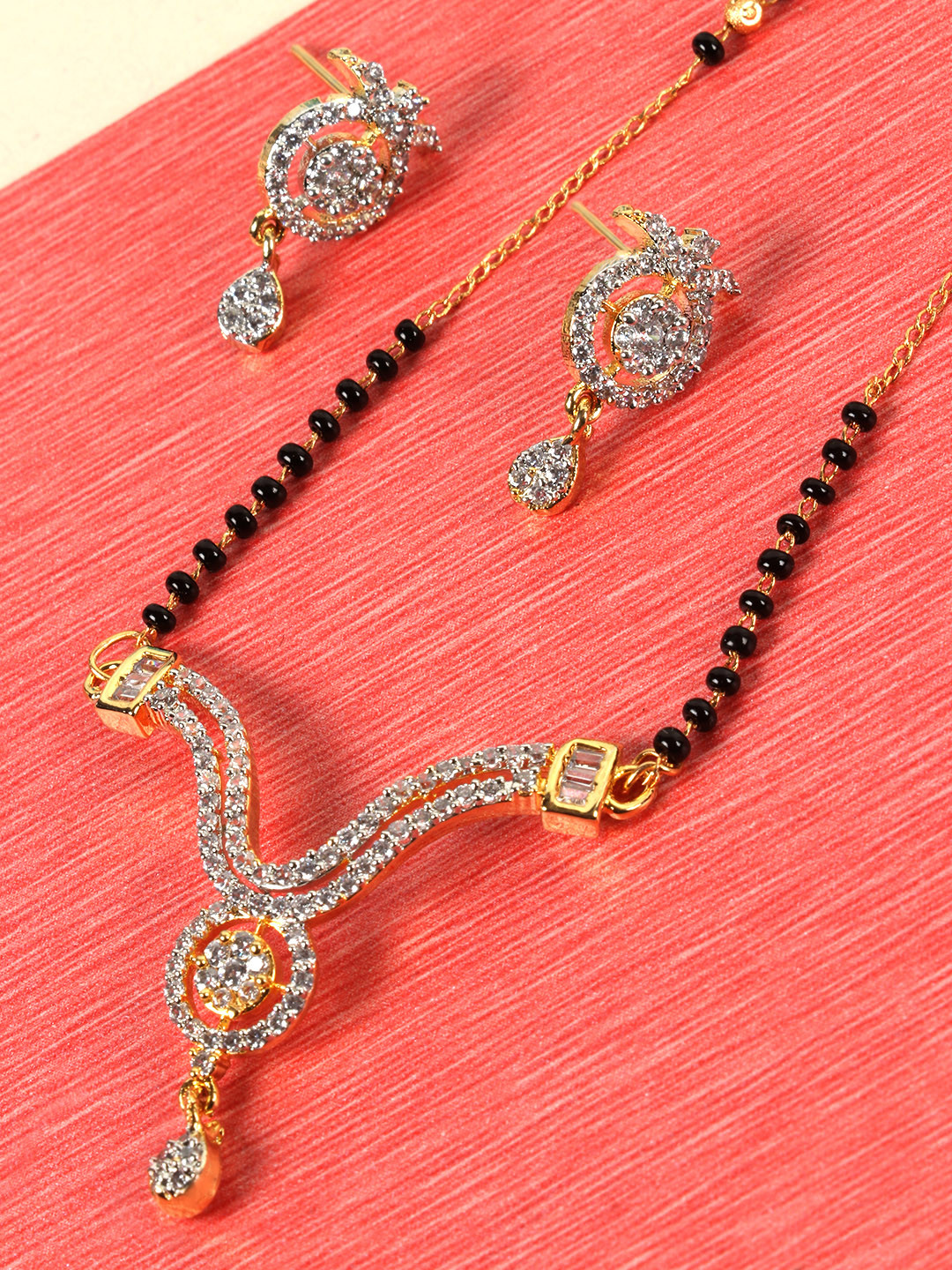 

JEWELS GEHNA Black Gold-Plated AD Studded & Beaded Mangalsutra & Earrings Set
