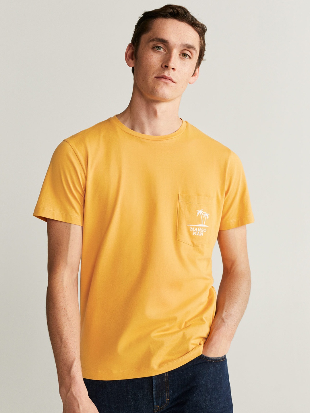 

MANGO MAN Mustard Yellow Solid Round Neck T-shirt