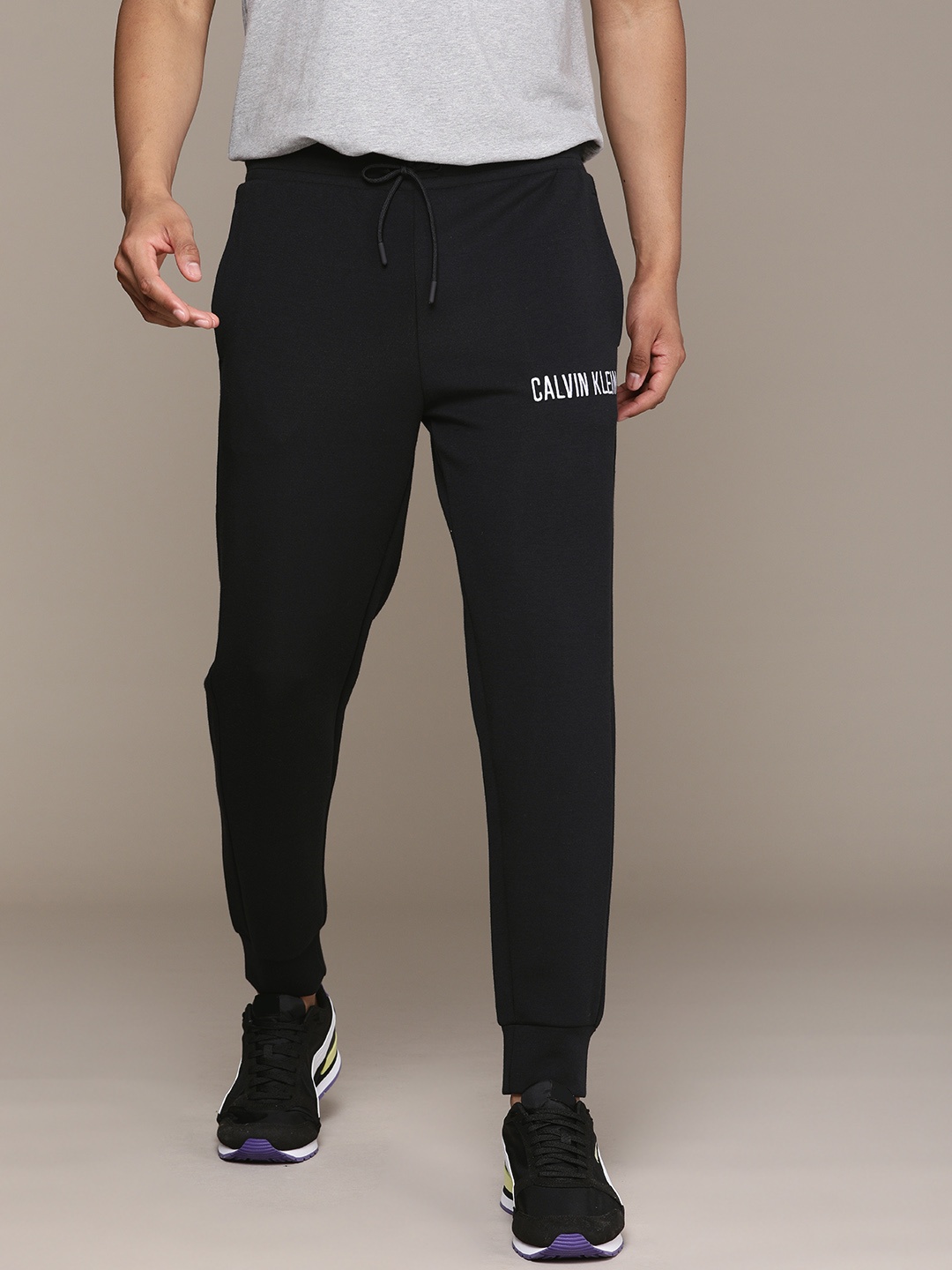 

Calvin Klein Jeans Men Black Solid Straight Fit Joggers with Printed Detail