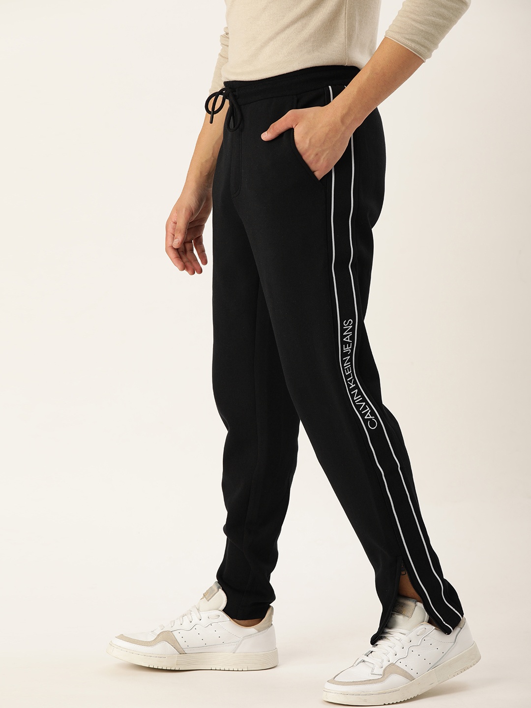 

Calvin Klein Jeans Men Black Solid Straight Fit Track Pants with Side Striped Detail