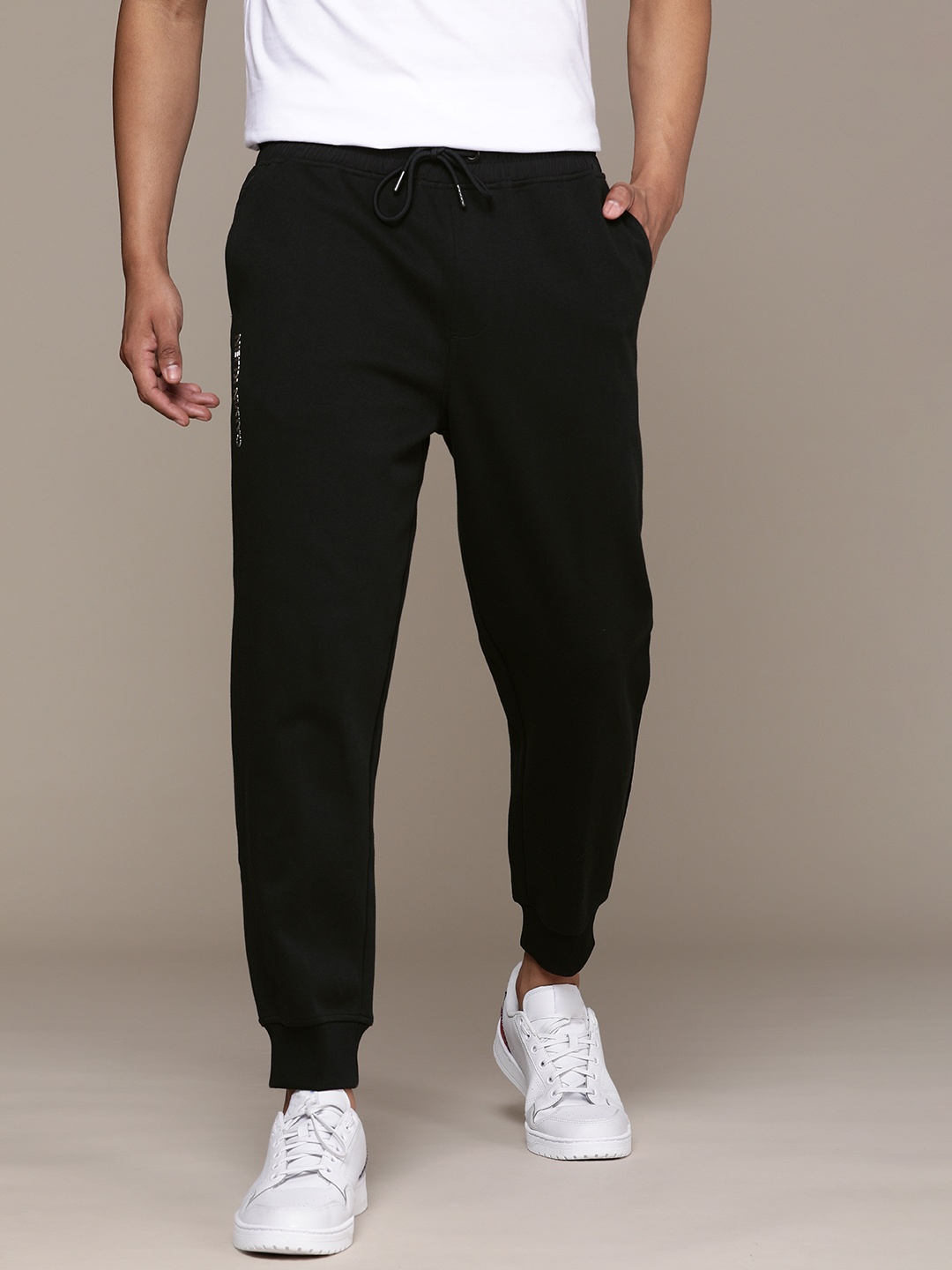 

Calvin Klein Jeans Men Black Solid Straight Fit Pure Cotton Joggers