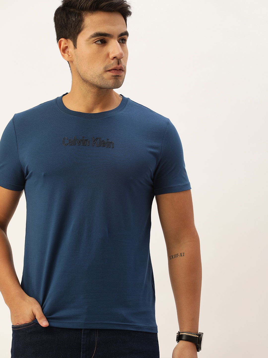 

Calvin Klein Jeans Men Navy Blue Slim Fit Solid Round Neck T-shirt with Logo Print