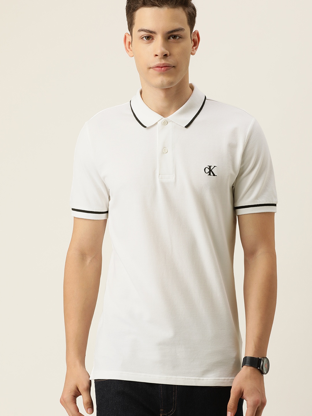 

Calvin Klein Jeans Men White Solid Polo Collar T-shirt With Embroidery