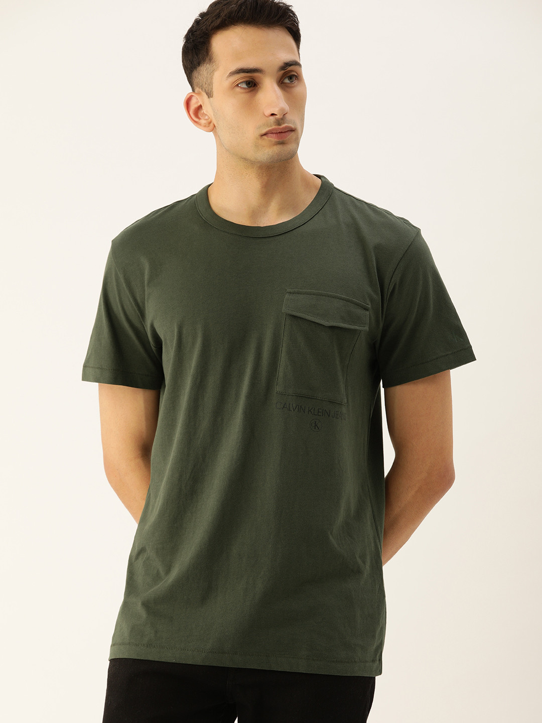 

Calvin Klein Jeans Men Olive Green Solid Round Neck T-shirt With Pocket