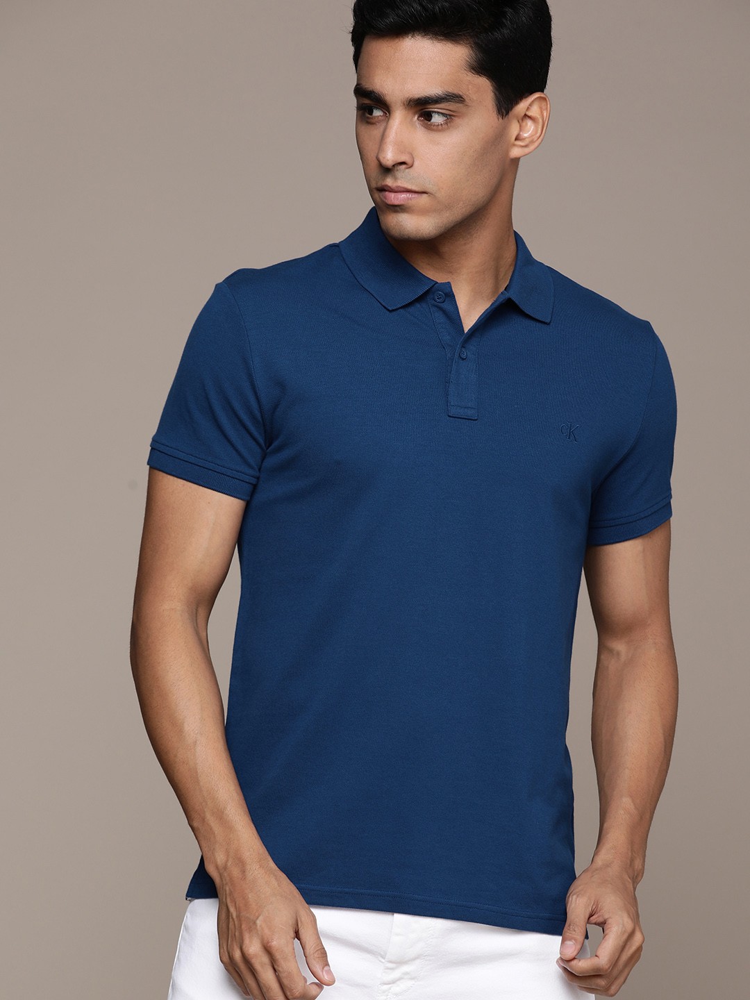 

Calvin Klein Jeans Men Teal Blue Brand Logo Back Printed Polo Collar Slim Fit T-shirt