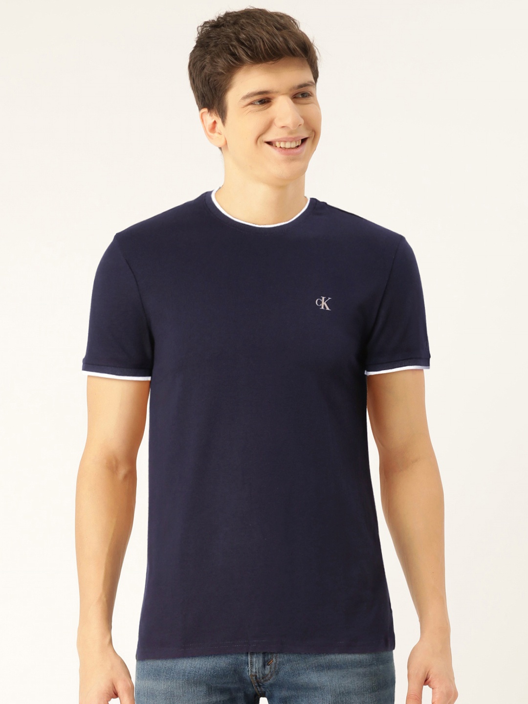 

Calvin Klein Jeans Men Navy Blue Solid Slim Fit Round Neck T-shirt